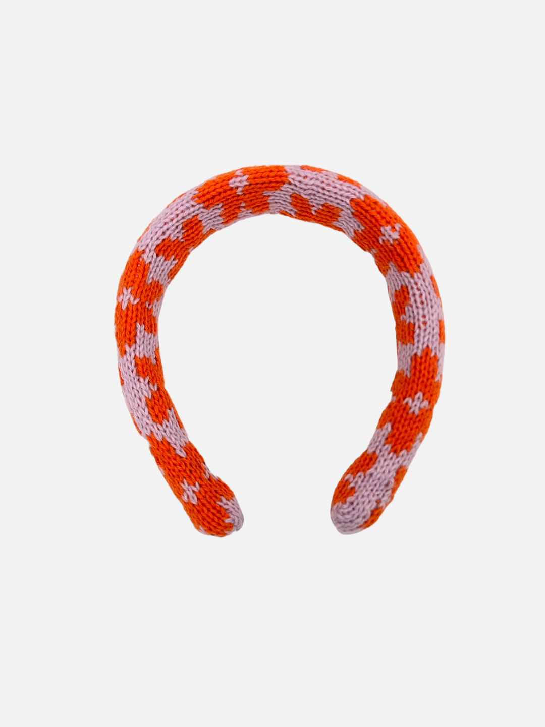 Purple/Orange Blossoms | A kids' knitted headband in a pattern of orange flowers on a pink background