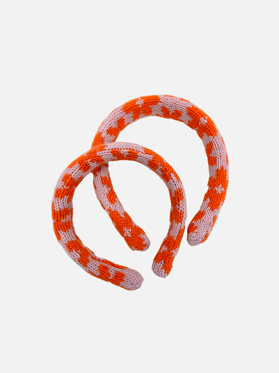 Purple/Orange Blossoms | Two sizes of kids' knitted headband in pattern of orange flowers on a pink background