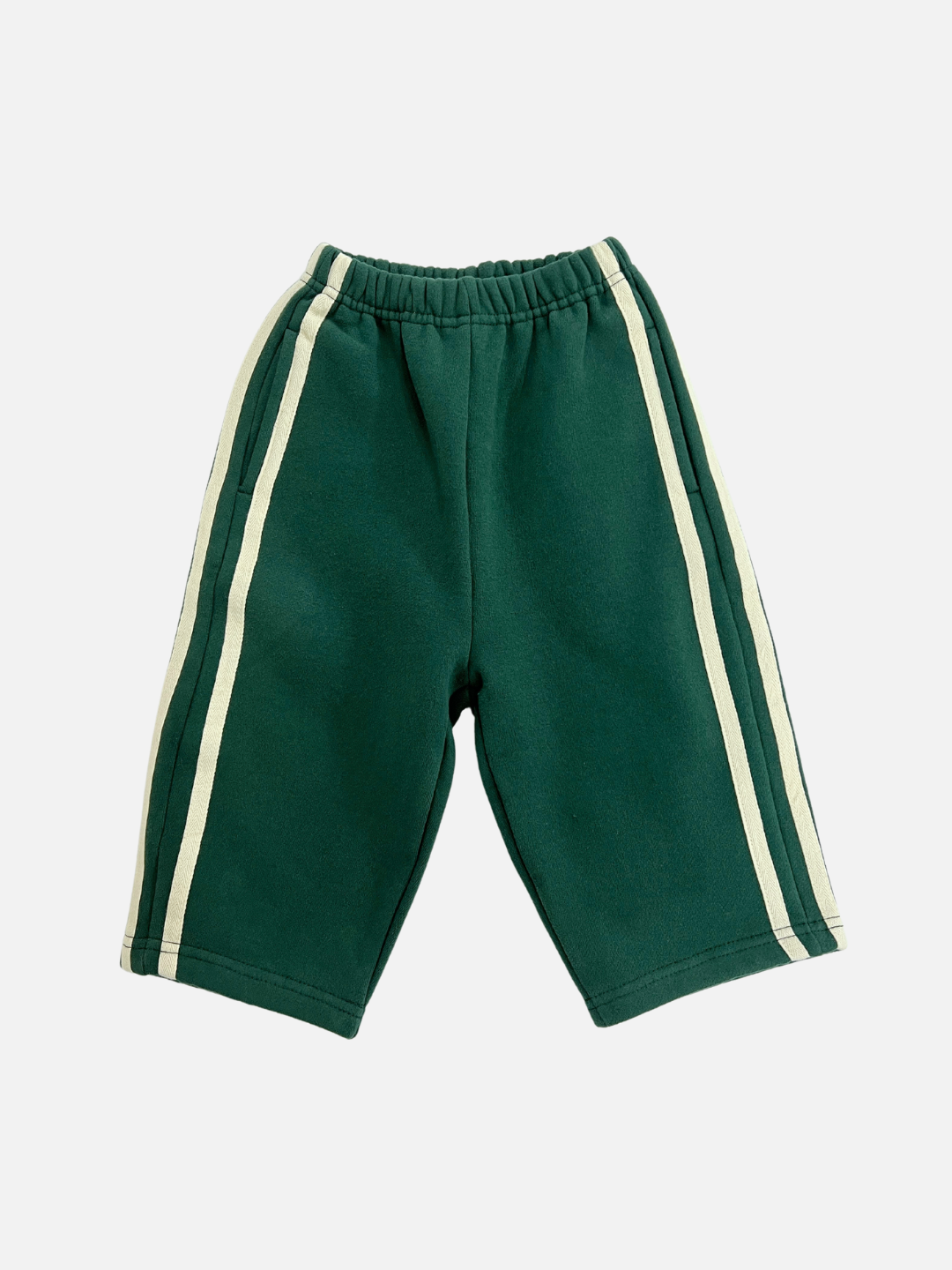 A front view of the kid's Varsity Pant in Hunter with white stripes on the sides.