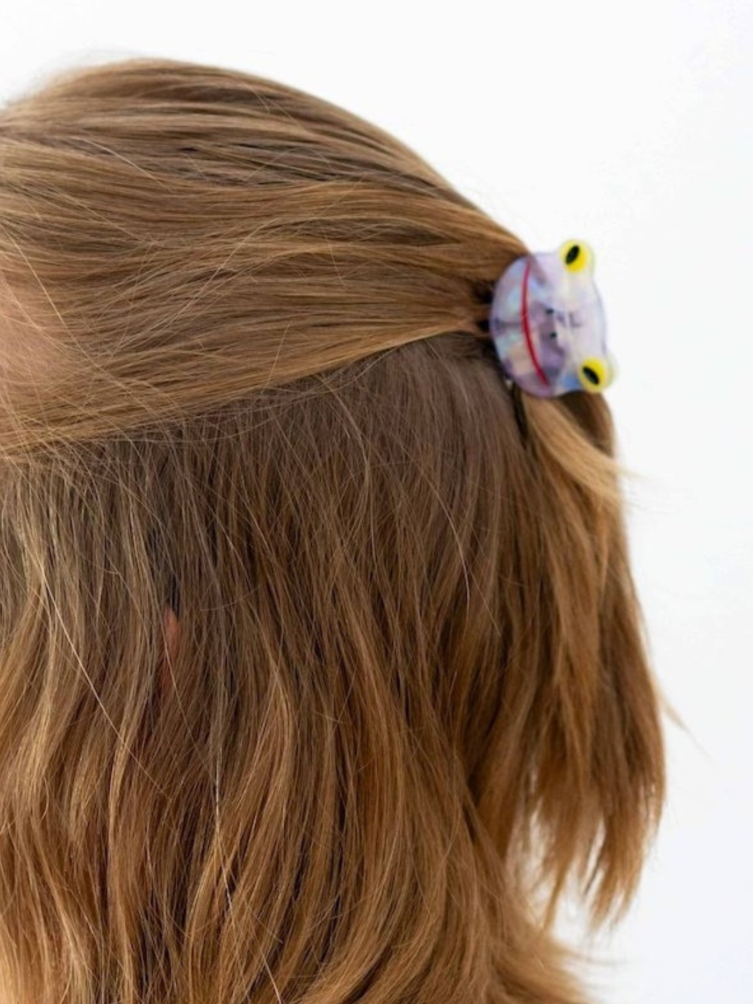 Lilac froggy hairclip on a half up half down hairstyle