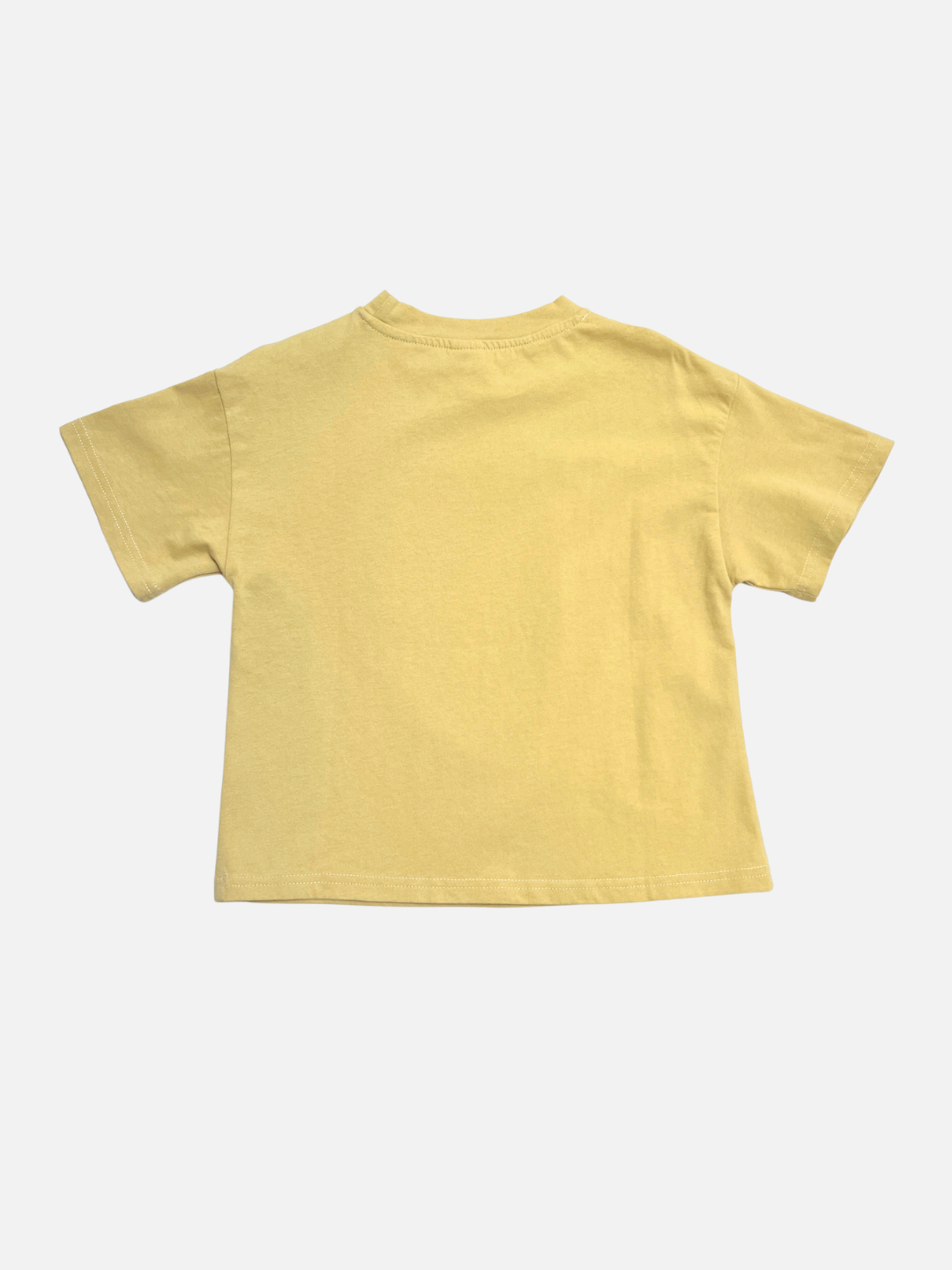 A plain, short-sleeve, light yellow CLOCK TEE by Milk Teeth is laid flat with the back facing up on a white background, highlighting its classic design and 100% cotton comfort.