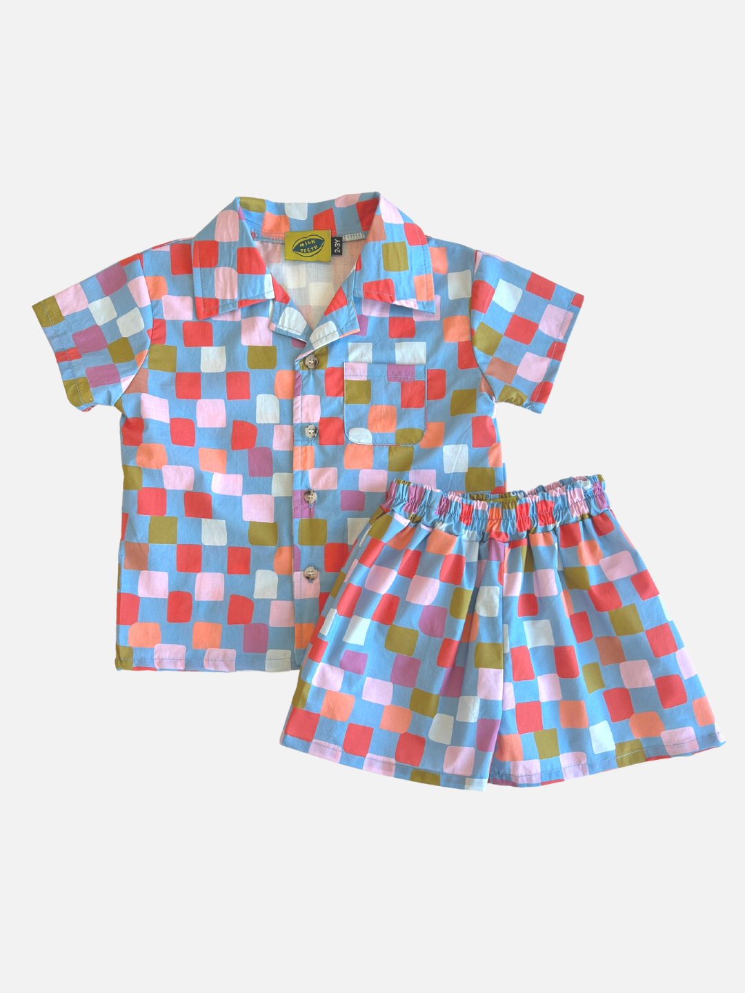 Blue | A kids' shirt and short set in a pattern of red, pink, lilac, orange and green squares on a blue background