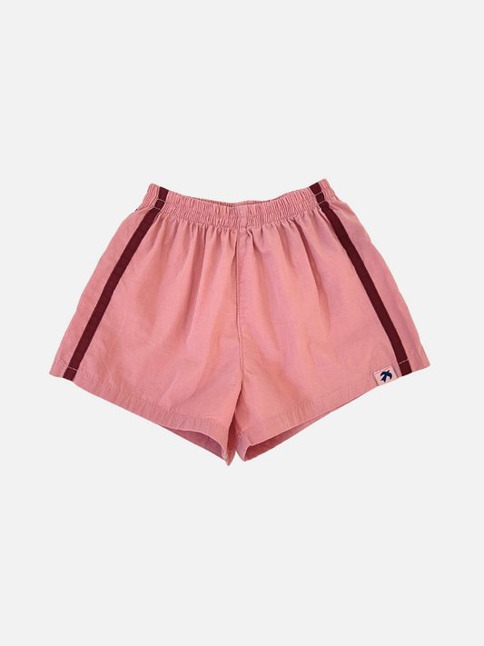 Image of Dusty Pink | Front view of the kids' dusty pink shorts with burgundy stripes on the sides. 