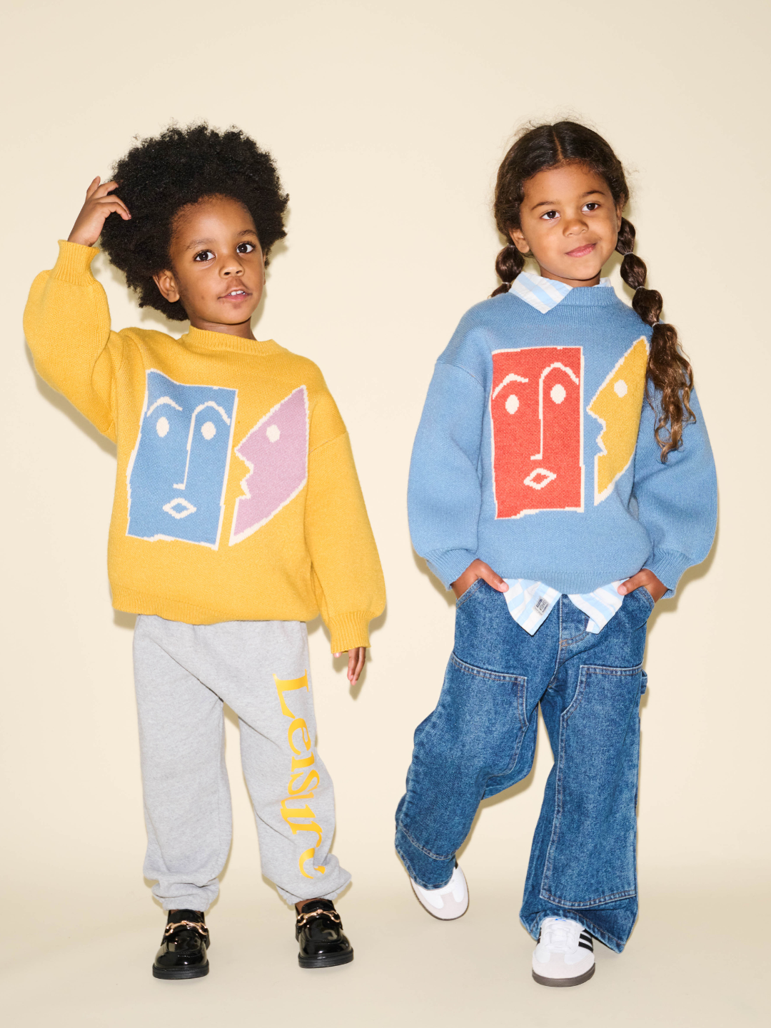 Slate | Two children are wearing Teatime sweaters in Slate and Marigold standing next to each other. 