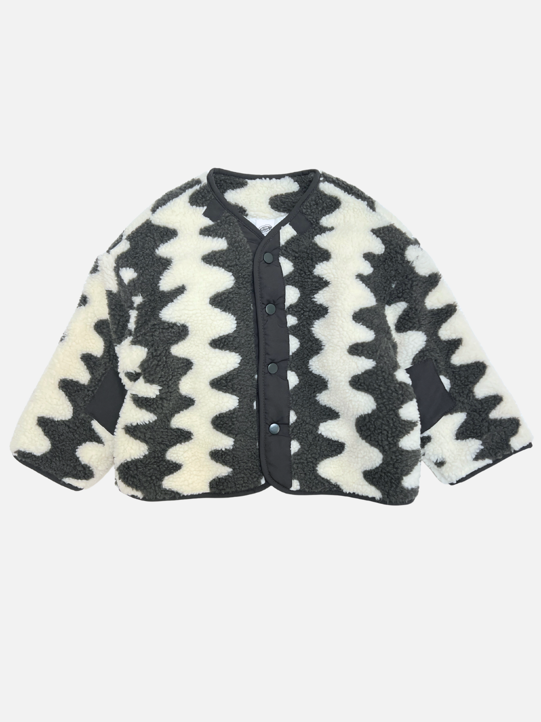 The WAVELENGTH SHERPA JACKET in Charcoal features a button-up front, black trim, zigzag pattern, and patch sleeve details, displayed flat on a white background.