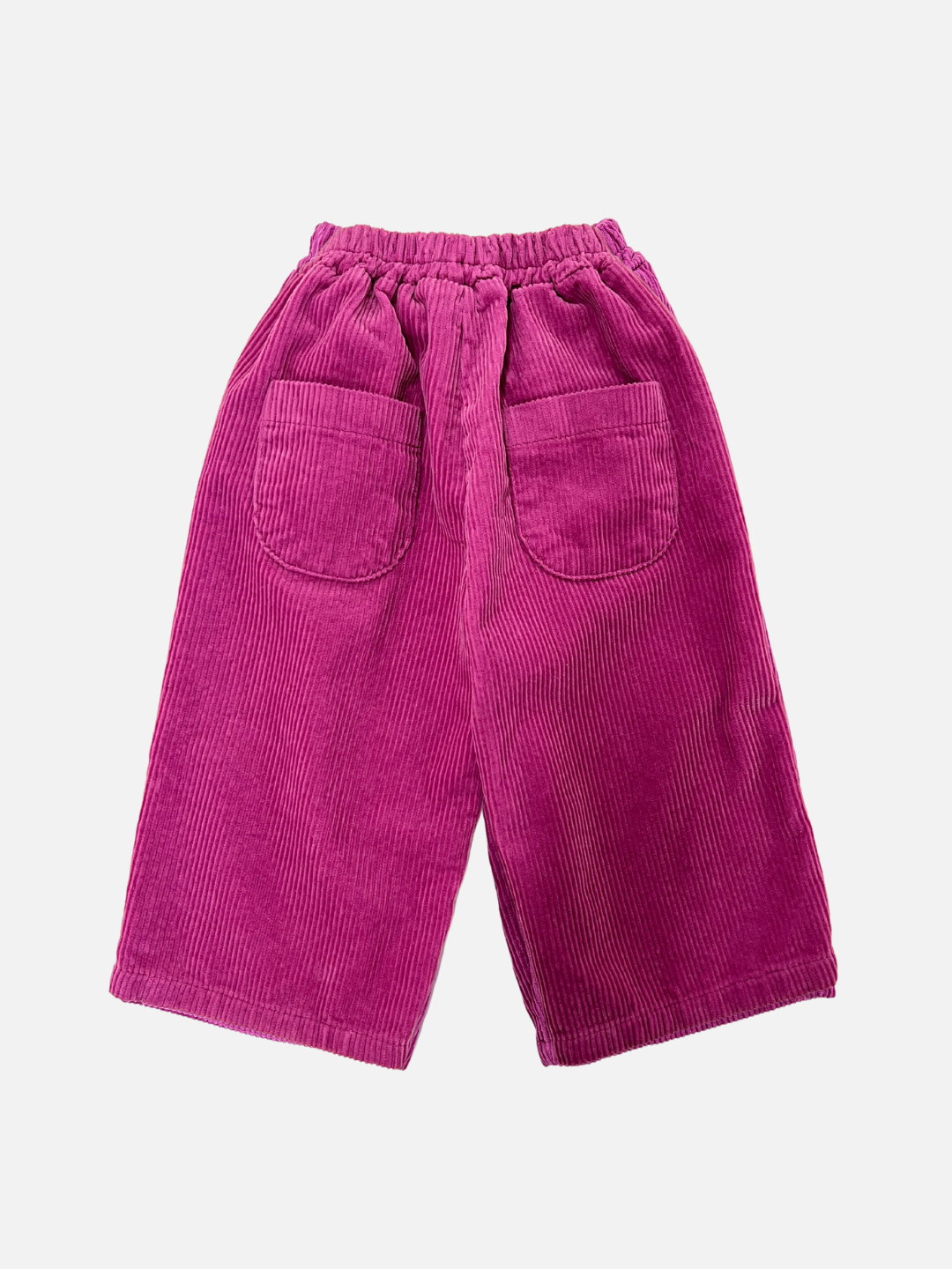 Magenta | Back view of kids wide-leg corduroy pants in magenta pink, showing two rounded back pockets.