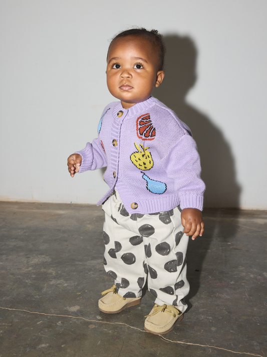 Second image of A lavender knit baby and toddler cardigan sweater featuring colorful embroidered fruit motifs including pears, strawberries, and citrus slices, displayed flat against a light gray background.