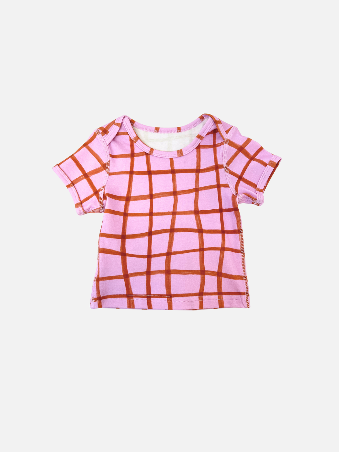 Imagine your little one in the PAINTBRUSH CHECK LAP-SHOULDER TEE, featuring a playful red grid on a crisp white background. Its delightful imagery makes it perfect for any occasion and sure to become a favorite.