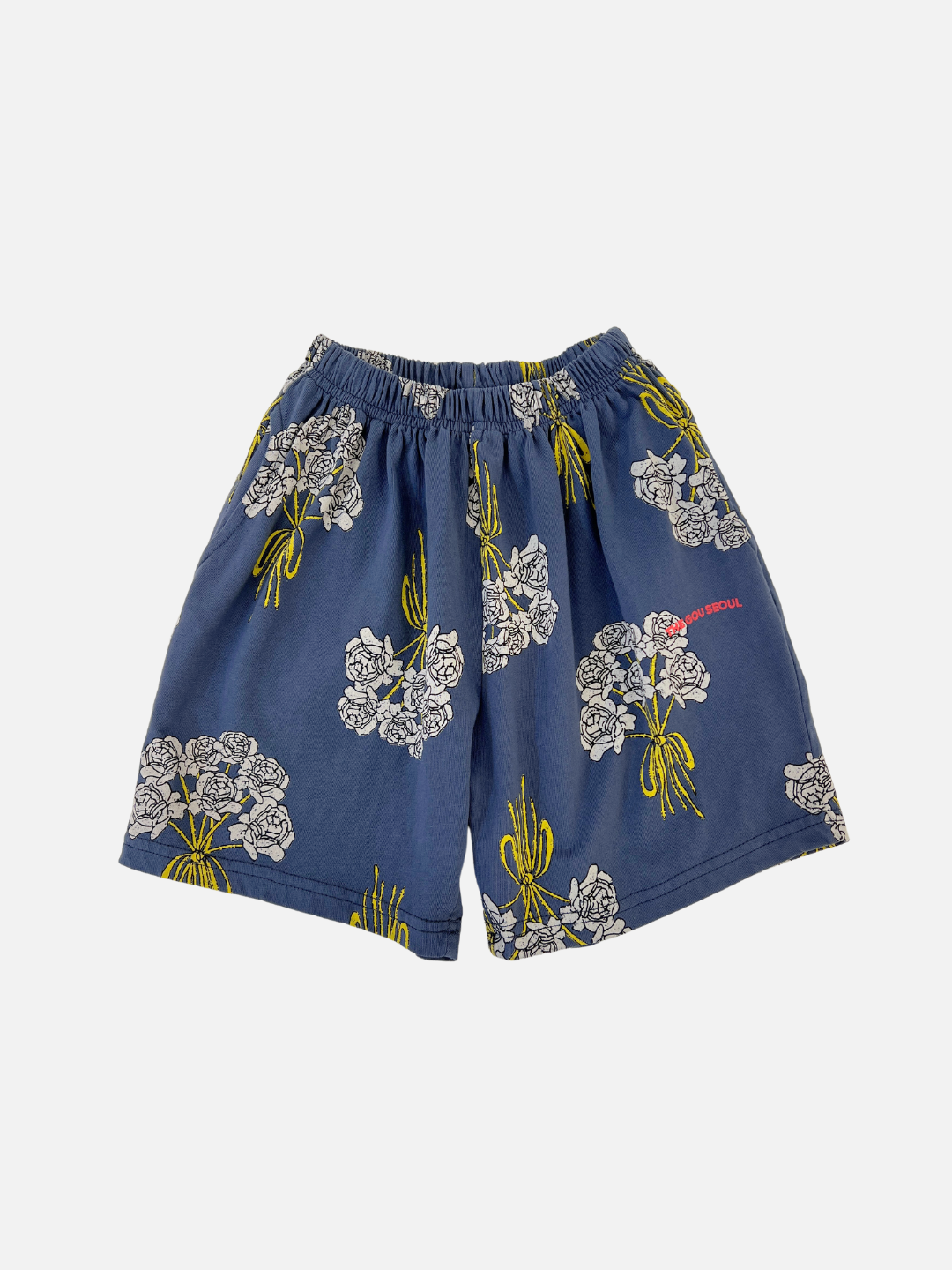 Front view of the kids' Bouquet Shorts. Navy cotton fabric with an all-over white roses bouquet print. 