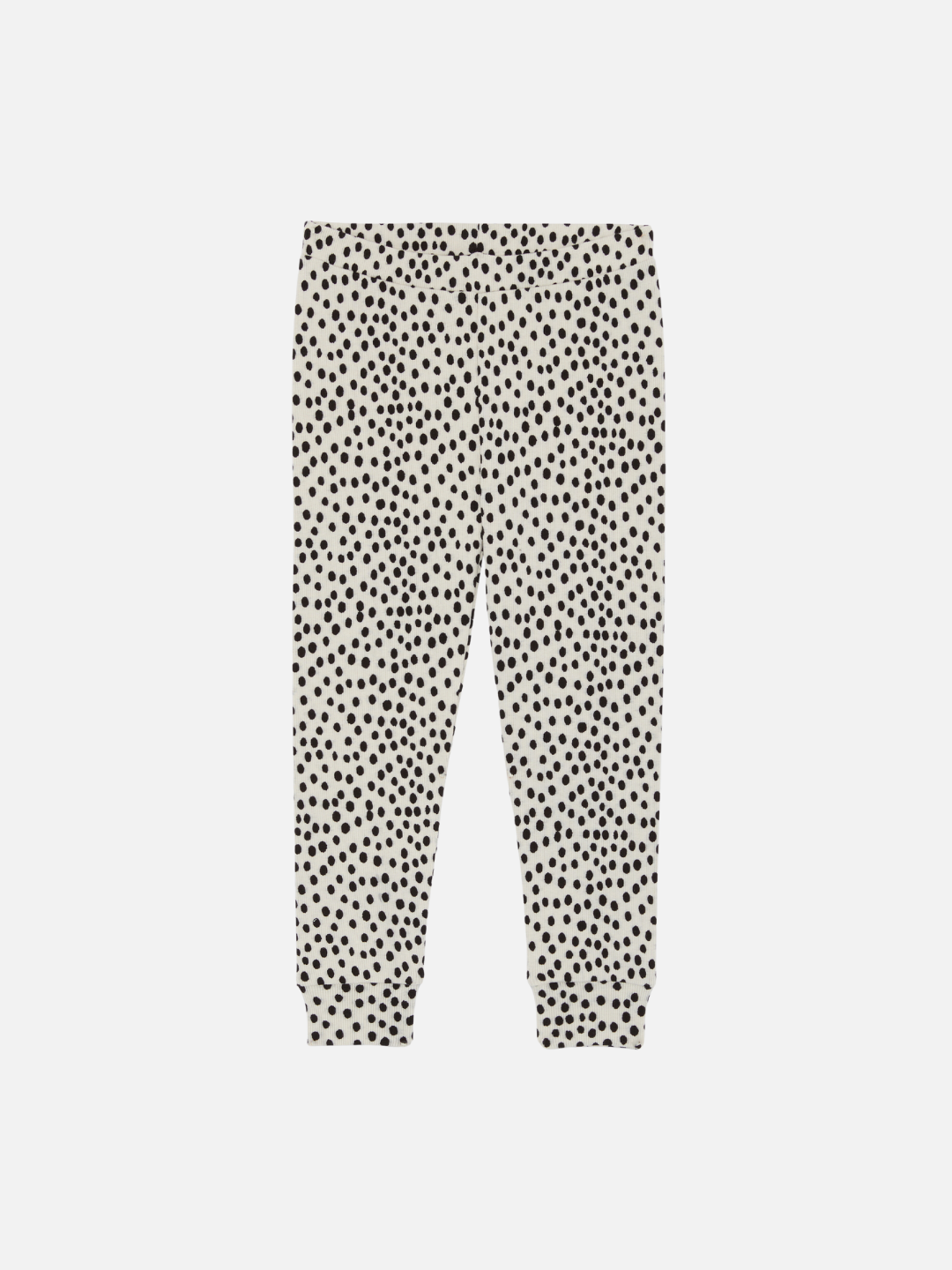 A pair of kids' leggings in a black and white mini cheetah dot print