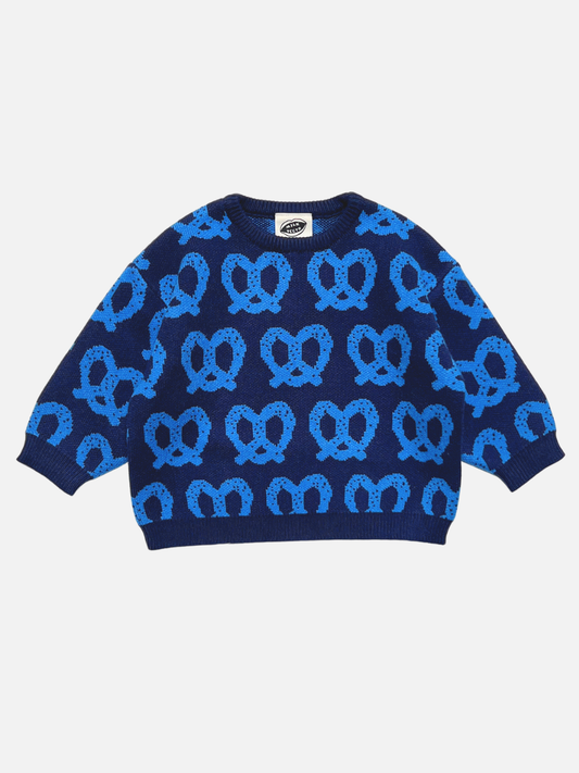 Image of Blue | A navy blue long-sleeve knit sweater with a repeating light blue pretzel pattern, laid flat against a light gray background.