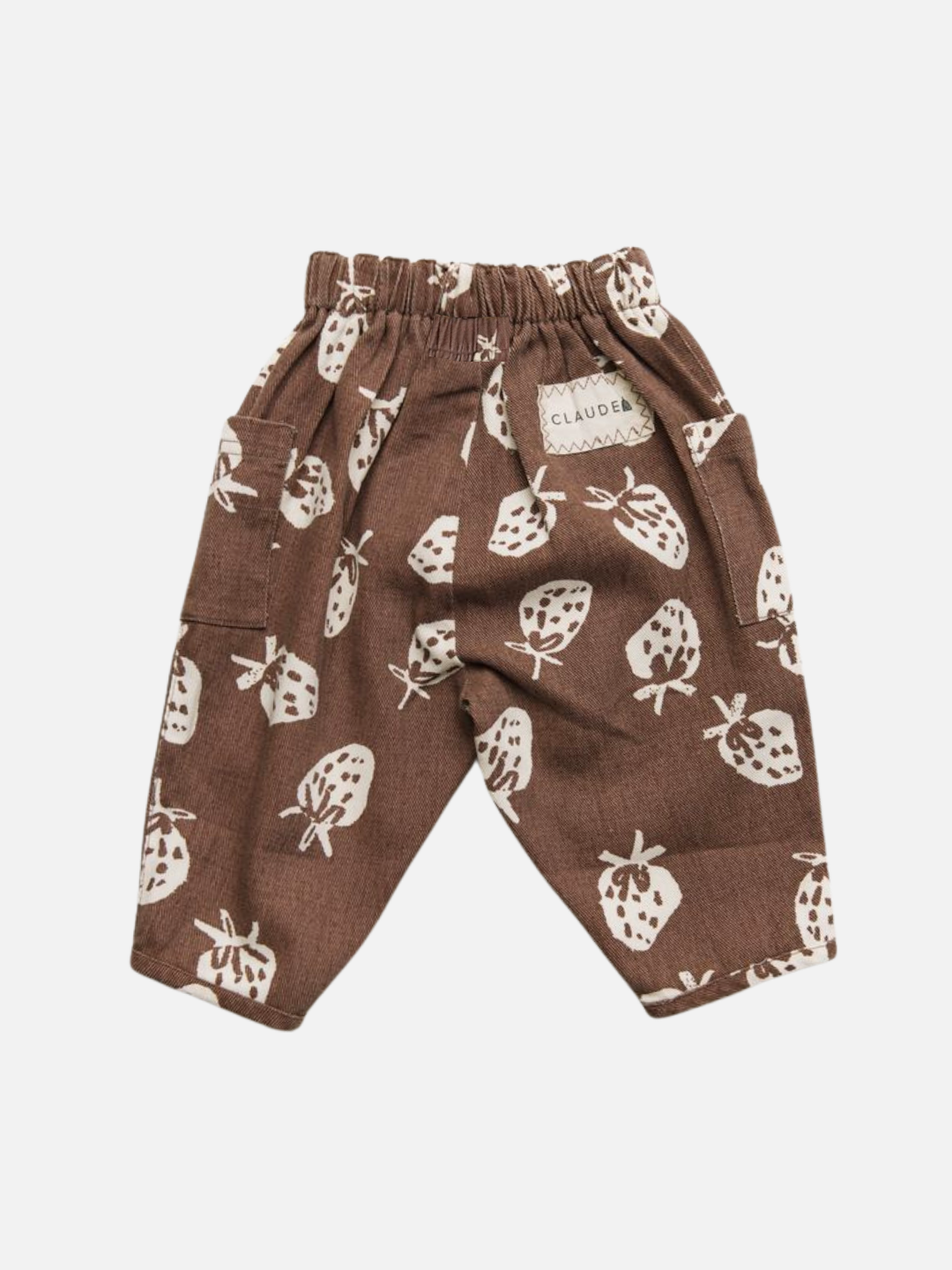 The EMERSON CHOC STRAB TROUSER are brown children's pants with an elastic waistband, a white strawberry pattern, patch pocket, and a "CLAUDEA" label.