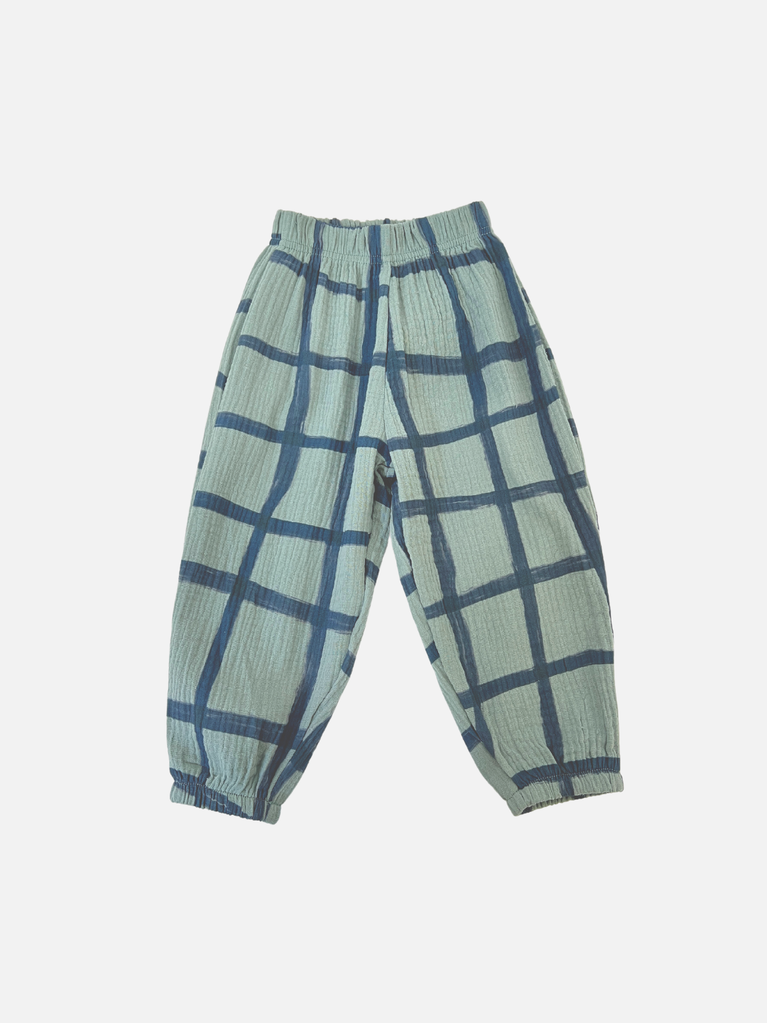 Sage/Slate Blue | PAINTBRUSH CHECK MUSLIN PANTS for toddlers feature an elastic waistband and cuffs with a large blue hand-drawn grid check pattern.