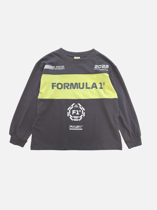 Image of The RACING LONGSLEEVE is a black kids’ crewneck tee with long sleeves, yellow chest stripe, white “FORMULA 1” text, and racing graphics. Made from soft cotton jersey by a top Korean kids' brand.