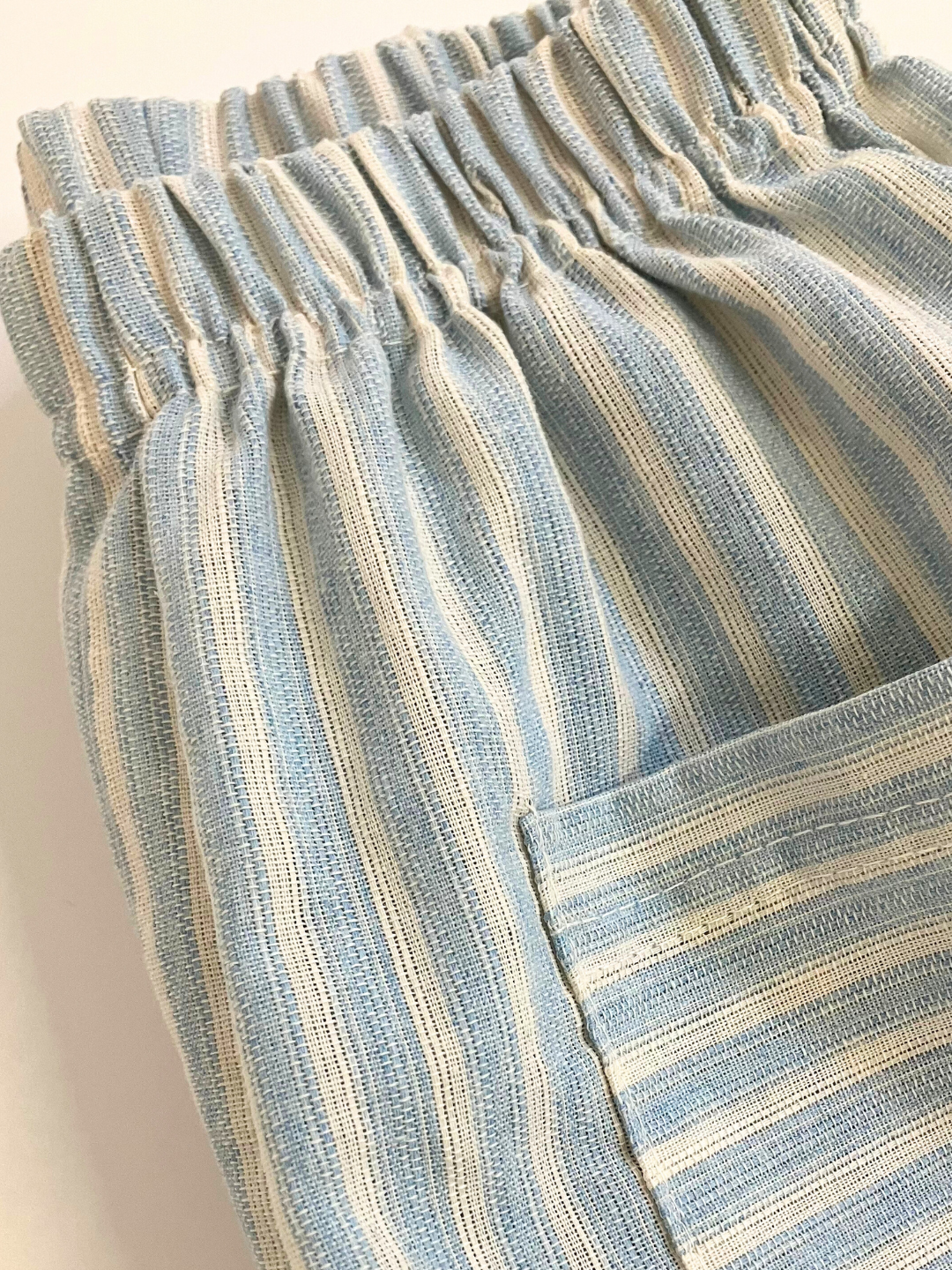 A zoom in on the texture of kids' Pocket Stripe Pant in light blue stripe