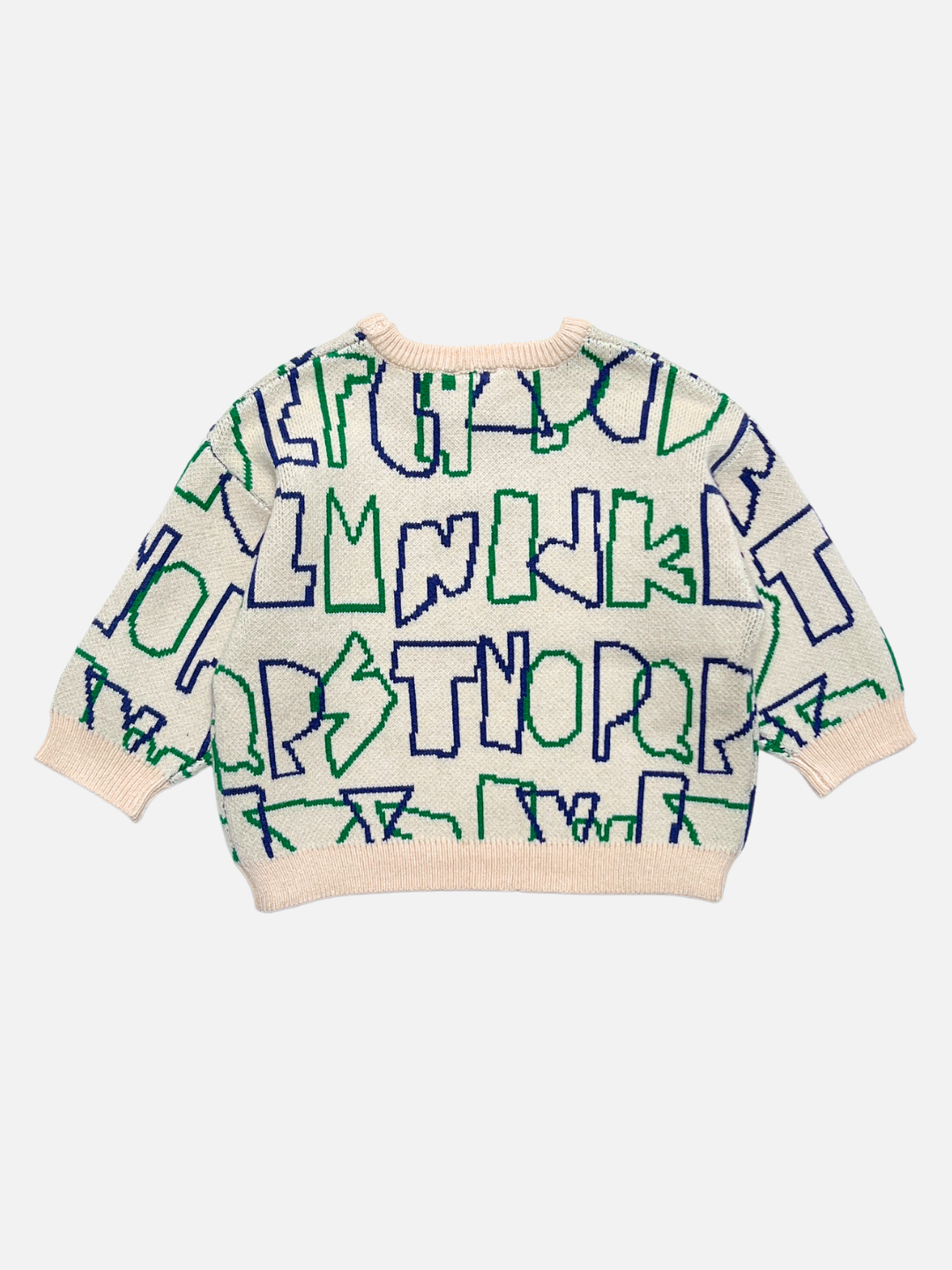 A cream-colored knit sweater with a playful, abstract pattern of blue and green alphabet letters, shown flat on a light gray background.