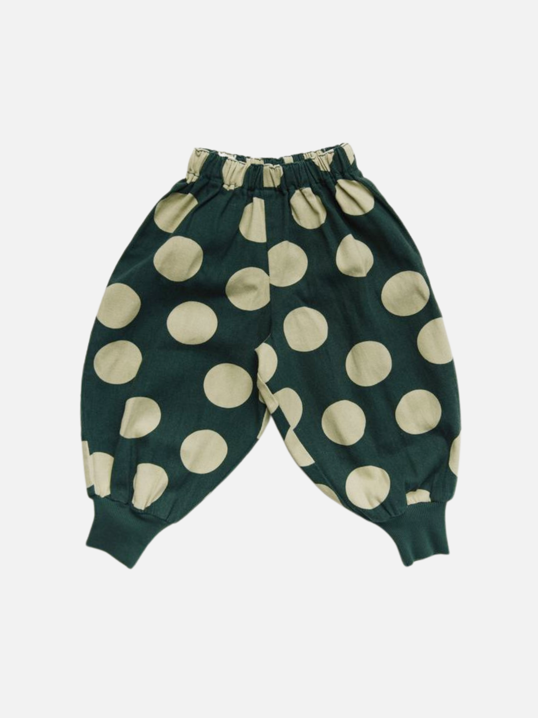 EMERSON KALE POLKA TROUSER: Dark green children's pants with bold beige polka dots, elastic waistband, and ribbed cuffs. Displayed on a white background.