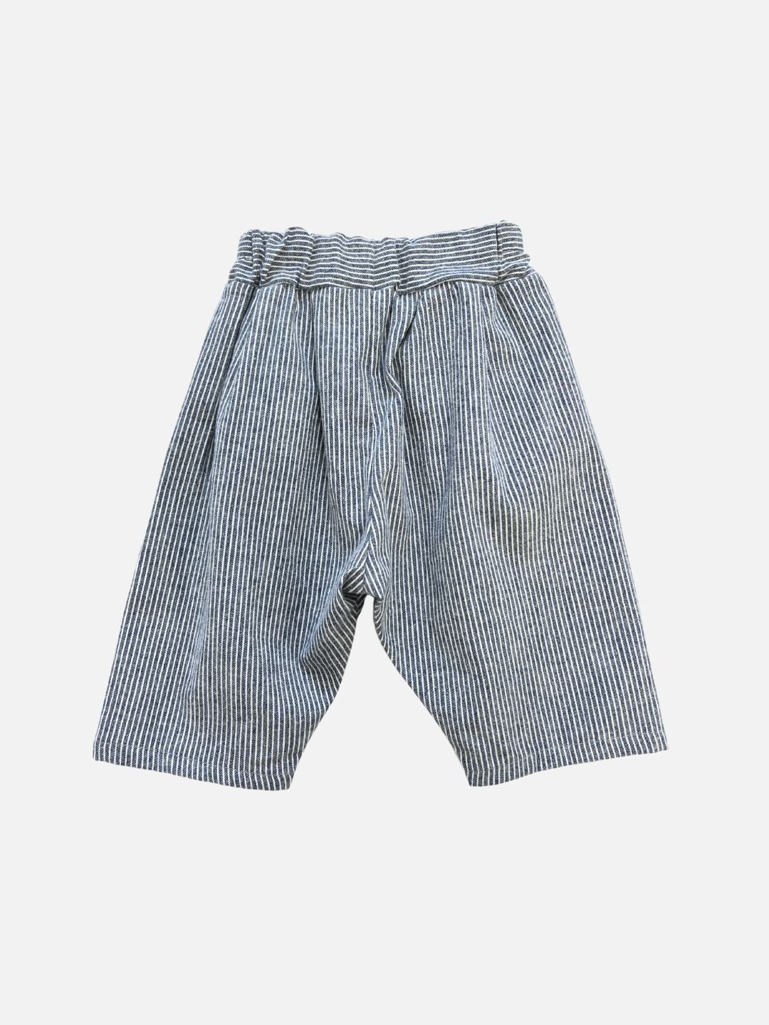 The SOFT STRIPE BABY PANT features a loose fit with blue and white vertical stripes and an elastic waistband, shown against a plain white background.