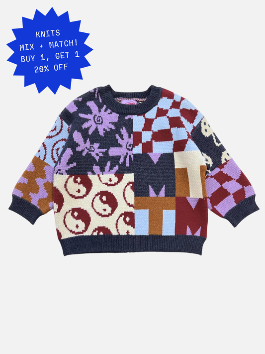 Image of The EVERYTHING SWEATER is a soft knit featuring a patchwork design with yin-yang symbols, flowers, wavy checkers, and geometric shapes in purple, red, cream, blue, and brown tones.