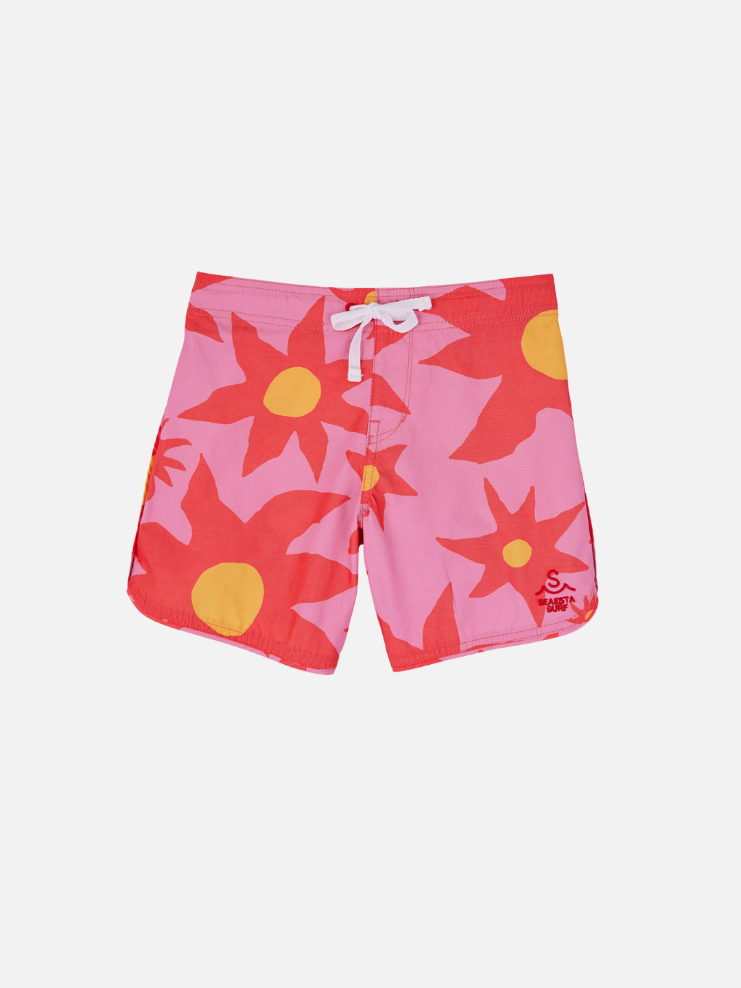 A front view of the kid's Siesta Scallop Retro Flare Boardshort, highlighting the adjustable waistband white, Saesta Swim logo on the left in pink. The design features large red flowers. 