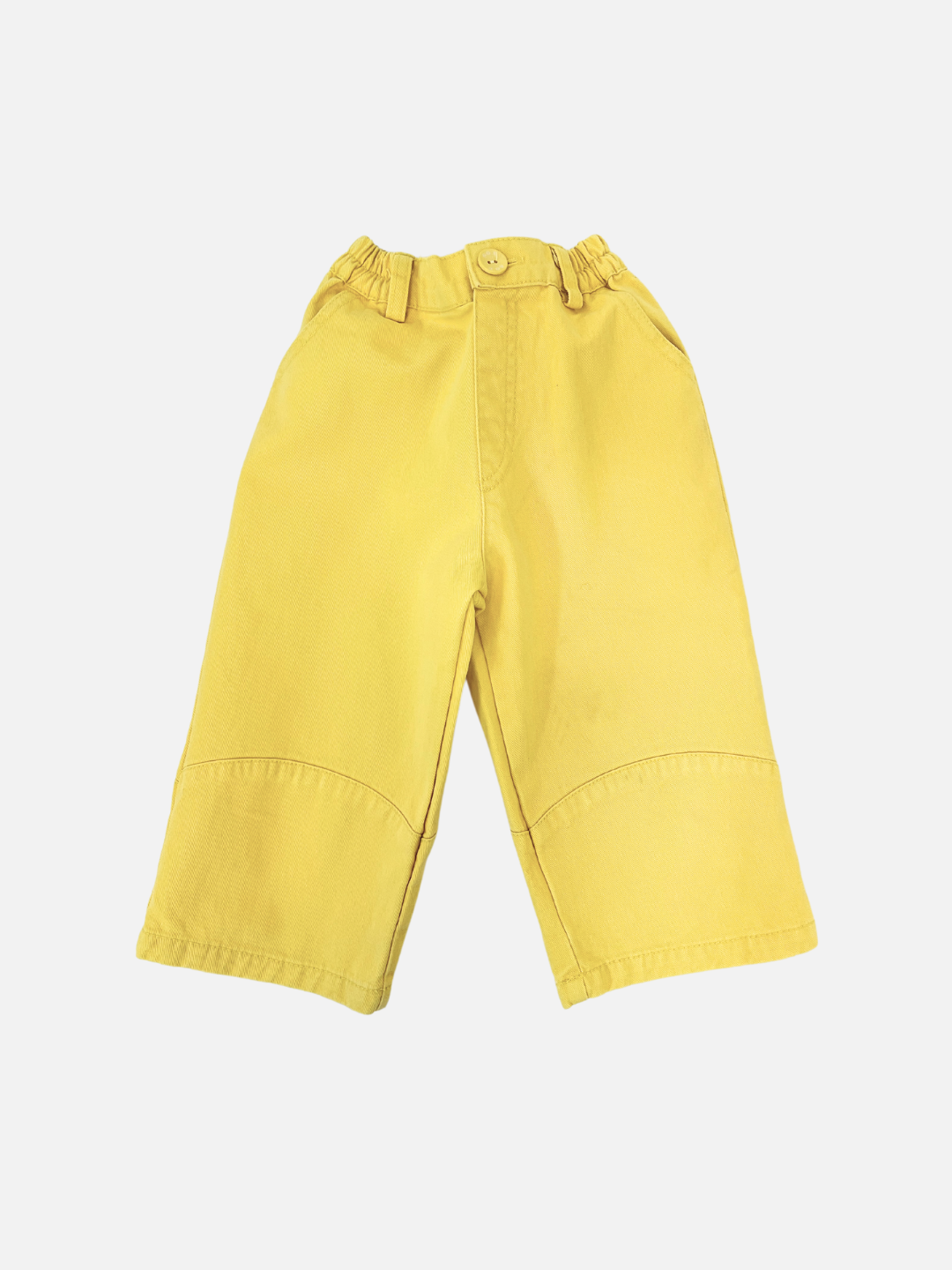 PICKLE PANTS are yellow children's cotton twill pants with an elasticated waist and button, shown on a white background.