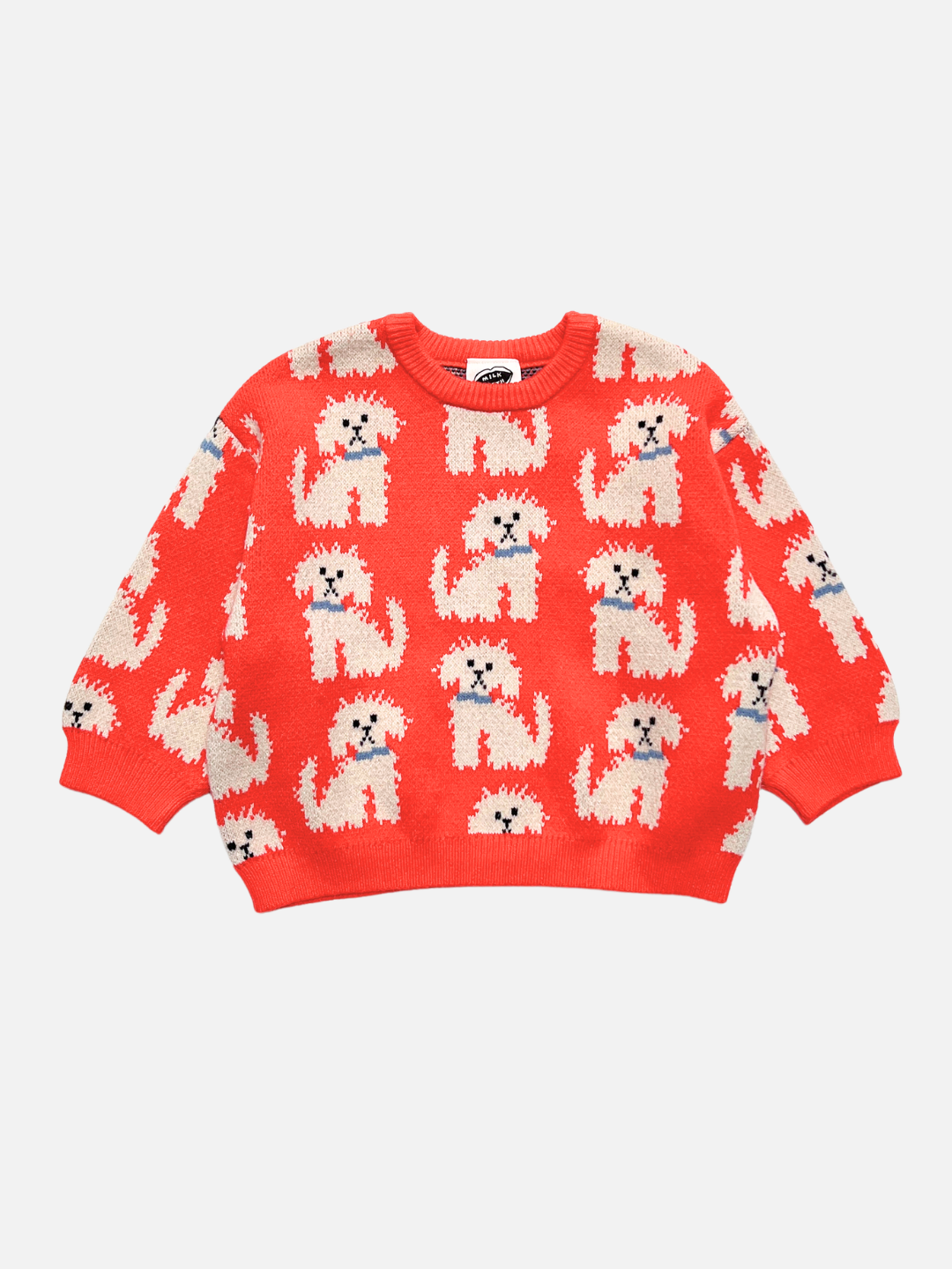 A orange-red crewneck sweater featuring an all-over knit pattern of white poodle dogs wearing blue collars, displayed flat against a light gray background.