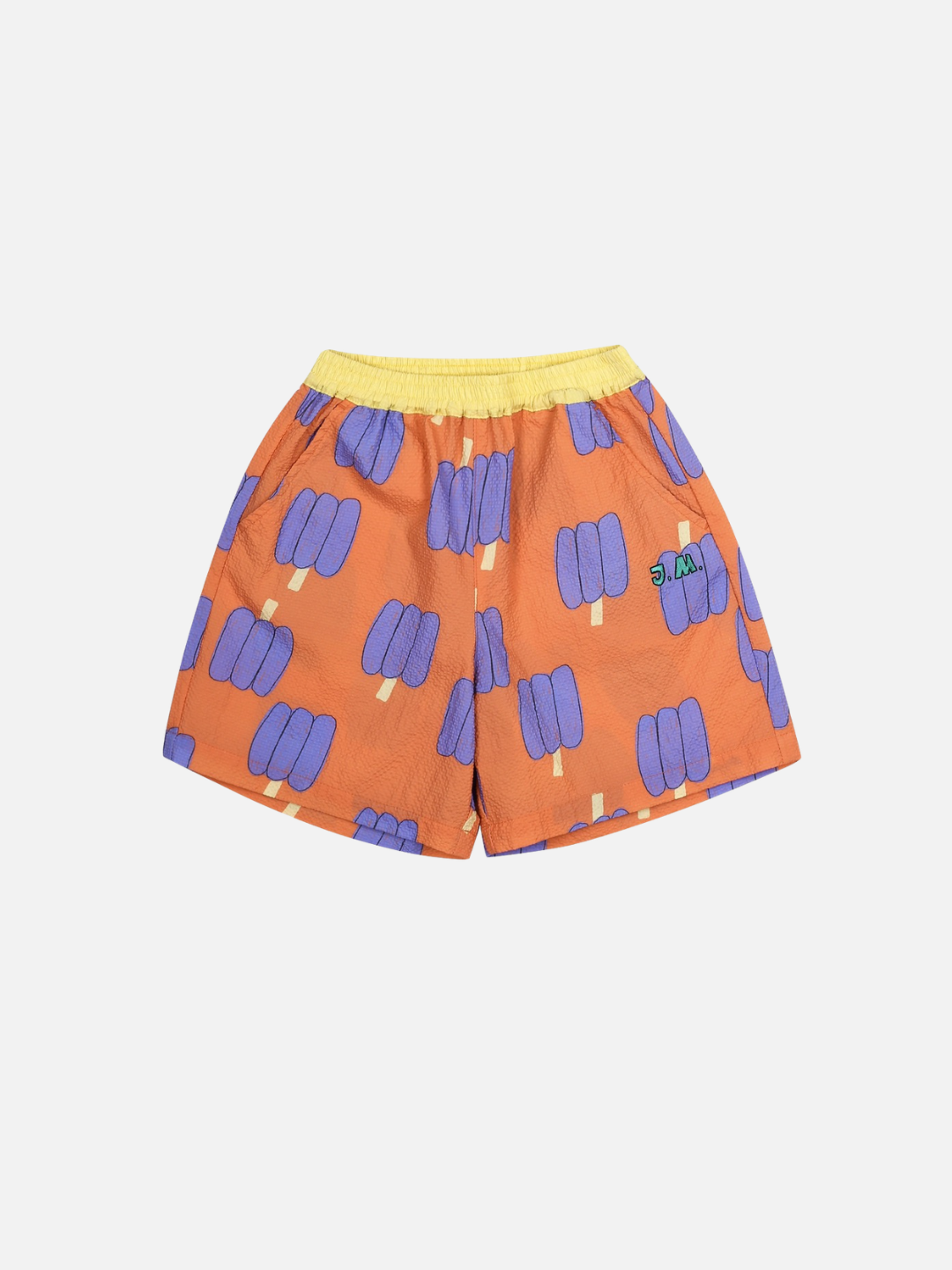 Orange shorts with purple bell pepper pattern on a white background