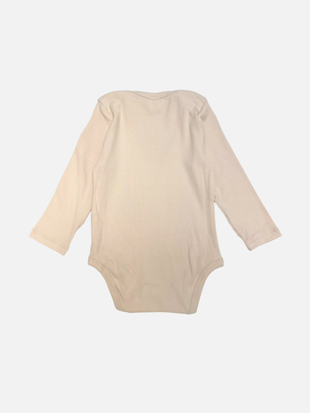 The SATURN LONG SLEEVE ONESIE, a beige ribbed cotton baby bodysuit with long sleeves, is laid flat on a white background, displaying the back side designed for easy diaper changes.
