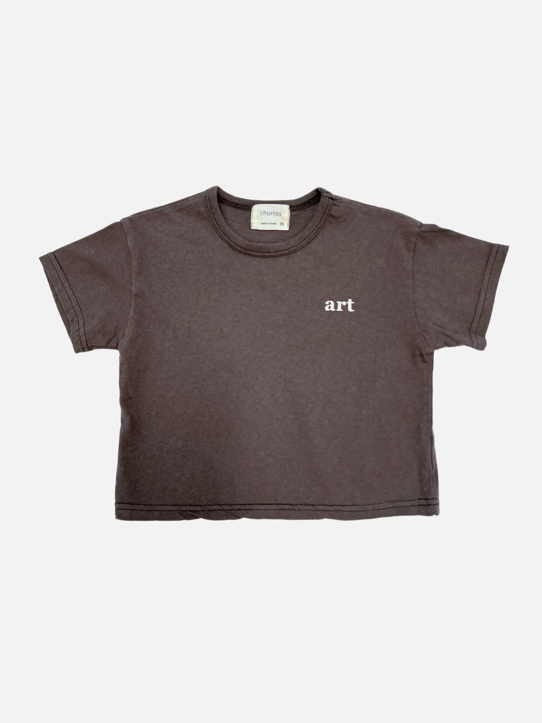 Front view of the kid's Studio tee in charcoal, with the words "art" printed on the right side
