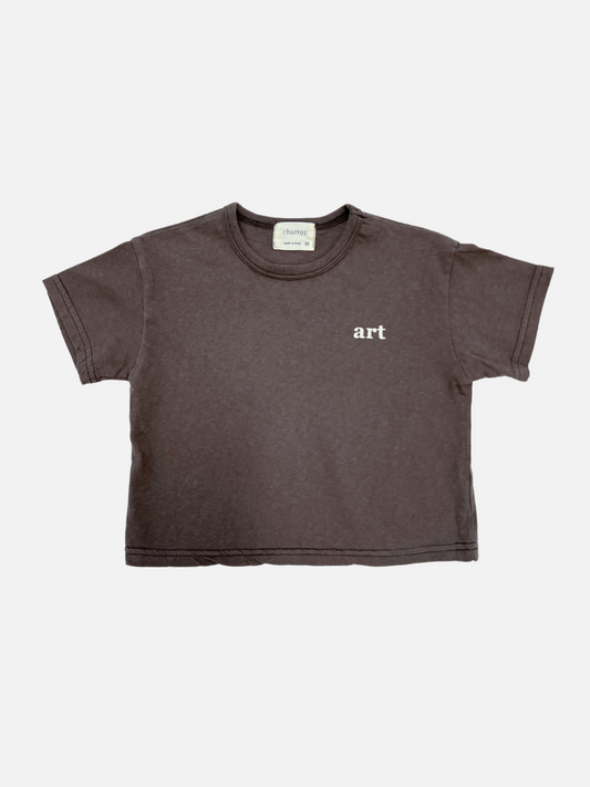 Image of Charcoal | Front view of the kid's Studio tee in charcoal, with the words "art" printed on the right side