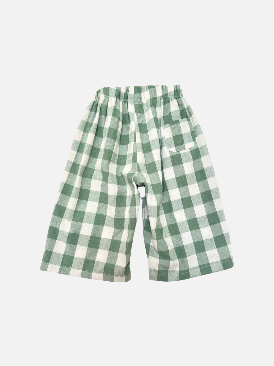 Green + White | GINGHAM BABY PANTS feature a green and white checkered pattern, wide-leg fit, elastic waistband, and a single front pocket—ideal for Korean baby clothing style. Shown on a plain white background.