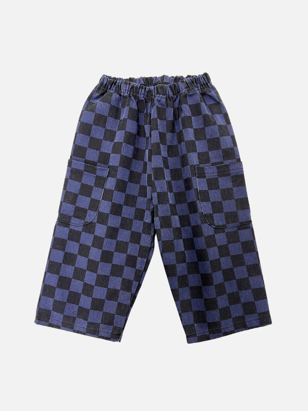 Front view of kids unisex baggy pants in a navy and black checkerboard pattern.