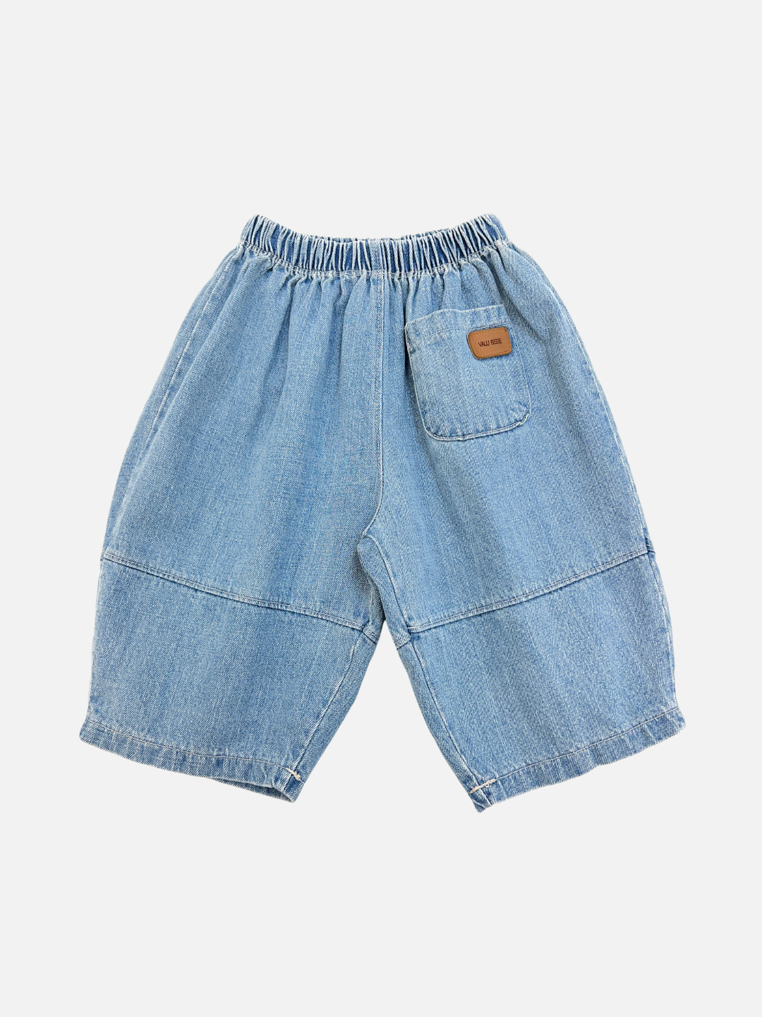 Blue | The BABY BALLOON JEAN in blue features light denim, an elastic waistband, one back pocket with a small brown label, wide legs, and stitched detailing for extra style and comfort.