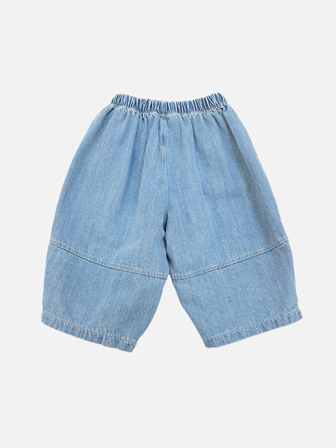 Blue | The BABY BALLOON JEAN features light blue, wide-leg denim shorts with an elastic waistband—ideal for relaxed summer days—shown on a white background.