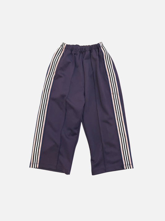 Image of Purple | MASKING TAPE PANTS in purple, featuring crisp white vertical side stripes, an elastic waistband for comfort, and wide legs. Displayed laid flat on a white background.