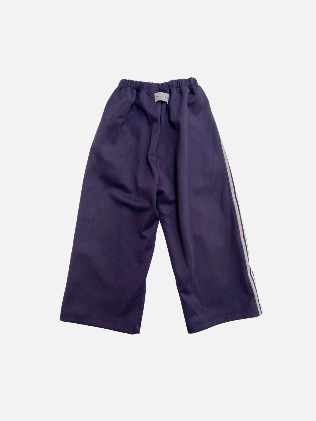 Purple | MASKING TAPE PANTS: Wide-leg purple track pants with white side stripes and an elastic waistband, shown laid flat on a white background.