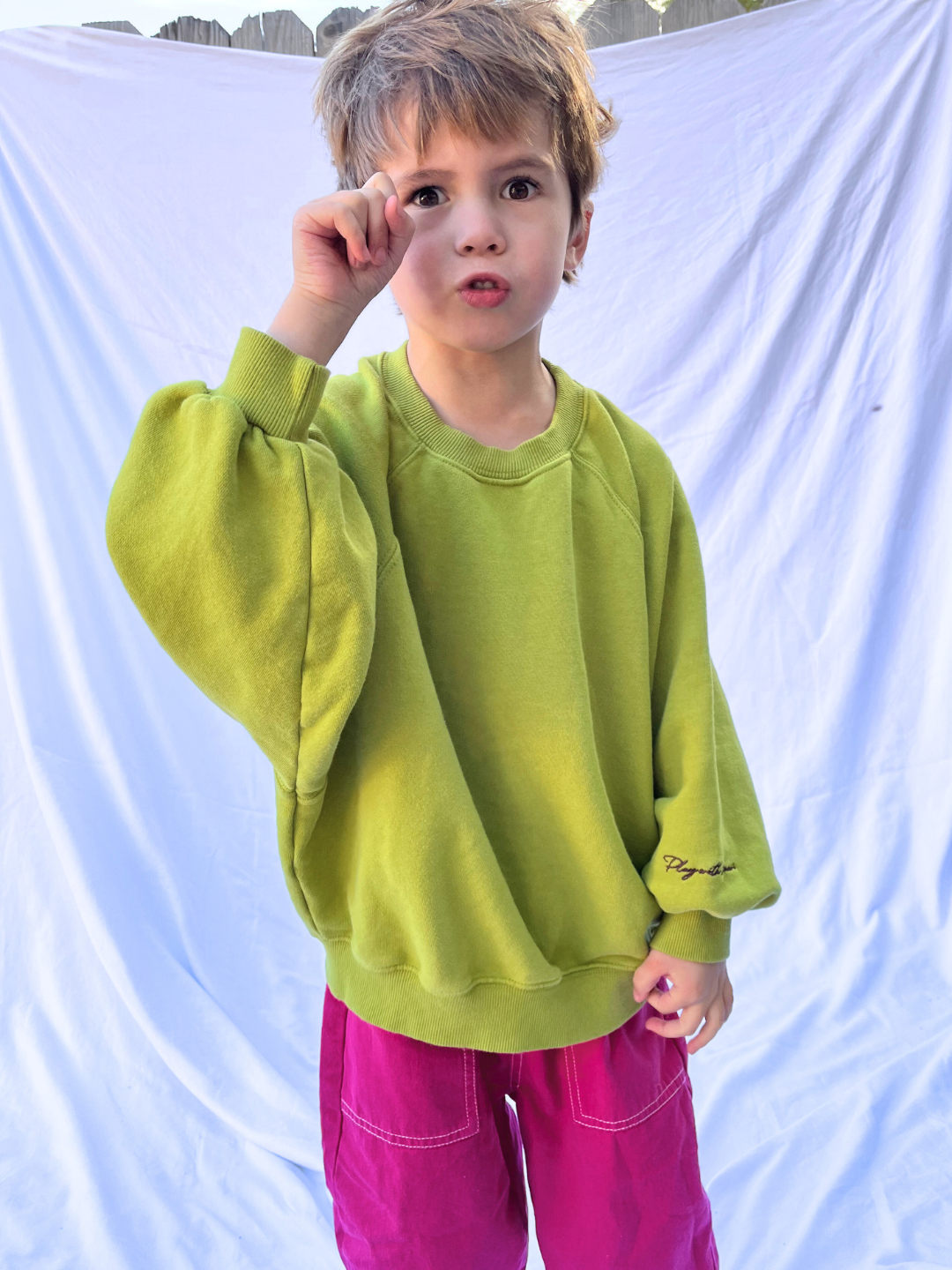 Loose-fitting PLAYDATE SWEATSHIRT in green garment-dyed cotton terry, featuring a wide neckline and tapered cuffs.