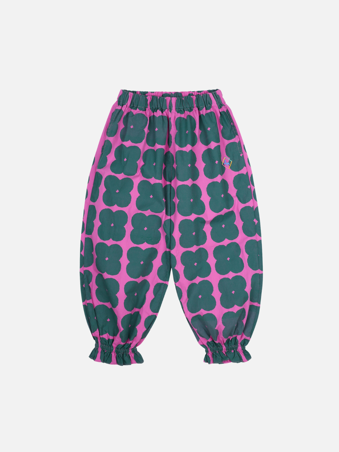 Front of Clover Pull-on Pants. Dark green clover shapes on a solid pink background. Cinched around the ankle and has an elastic waist.