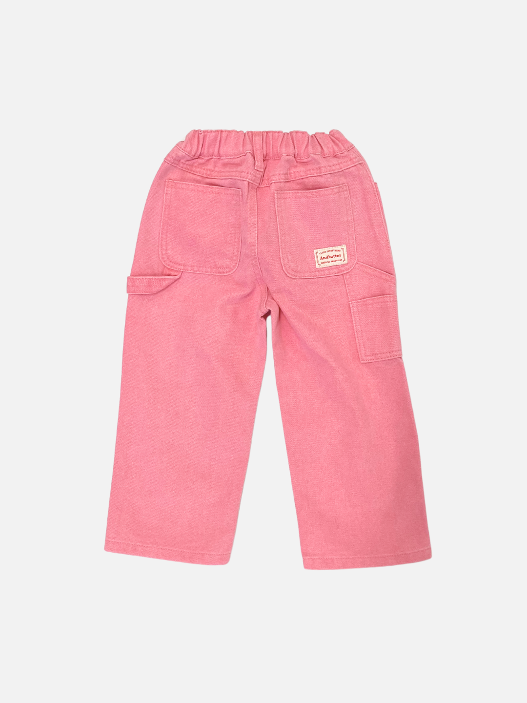 Peony | The PIGMENT CARPENTER JEANS are a pair of pink trousers crafted from pigment-dyed denim, featuring an elastic waistband, two back pockets, and one side pocket.