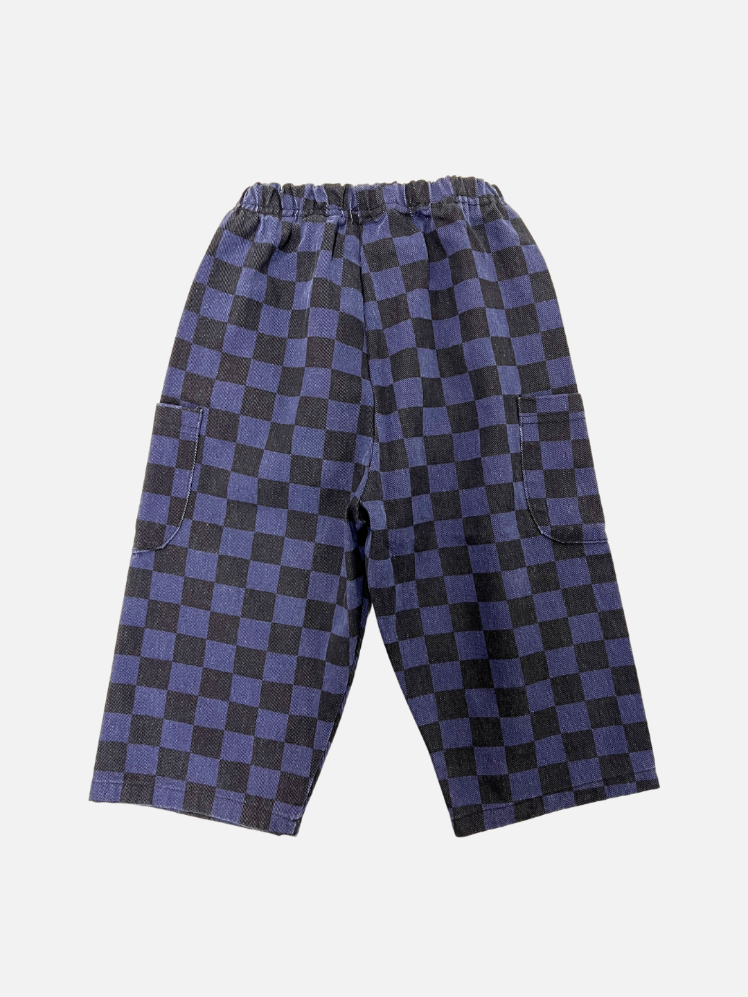 Back view of kids unisex baggy pants in a navy and black checkerboard pattern.