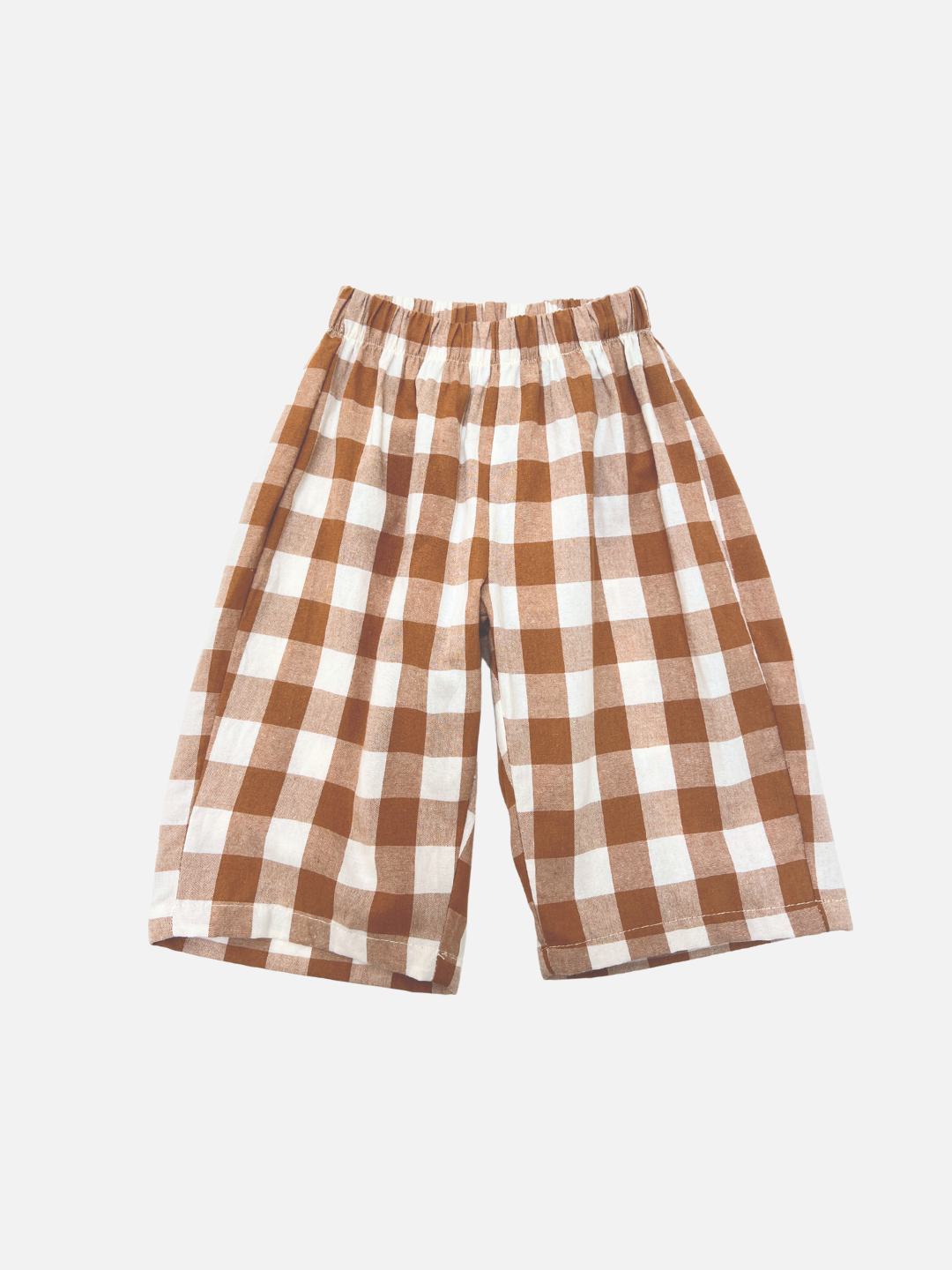Brown + White | GINGHAM BABY PANTS feature a brown and white gingham pattern with an elastic waistband, offering cozy comfort for your little one. Perfect for any Korean baby clothing collection. Shown on a plain white background.