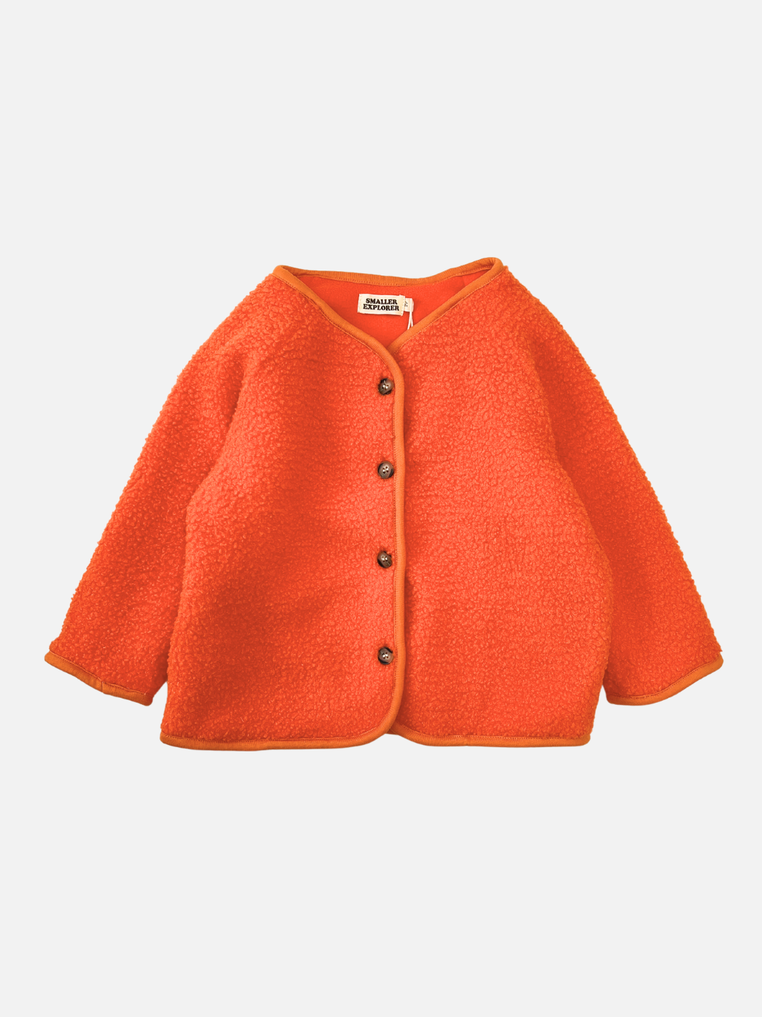 Front view of a kids orange collarless fleece jacket with four brown buttons.