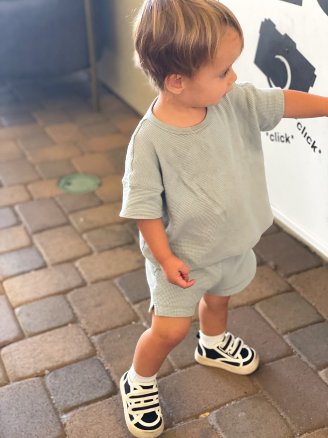 Child wearing the Black Bounce House Sneakers