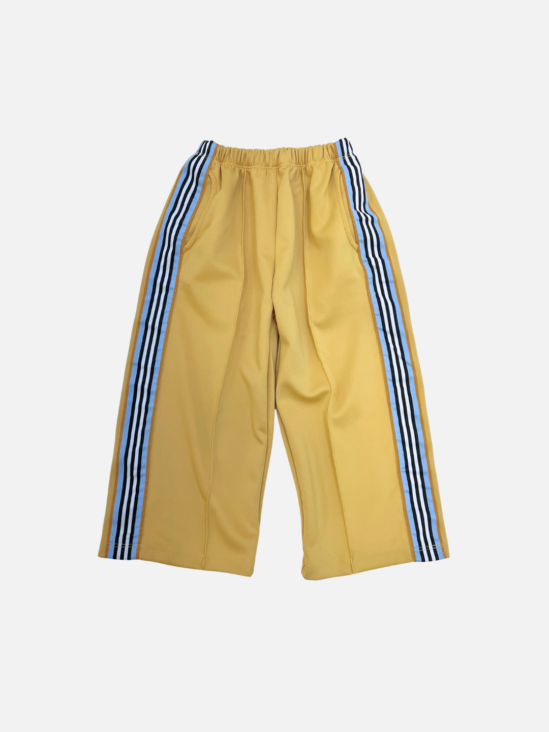 Yellow | The MASKING TAPE PANTS are yellow wide-leg pants featuring an elastic waistband and bold blue-and-white striped detailing down the sides, shown against a plain white background.
