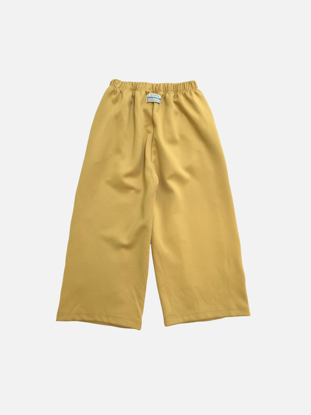 Yellow | The MASKING TAPE PANTS are wide-leg yellow pants with an elastic waistband, made from soft cotton and displayed flat on a white background.