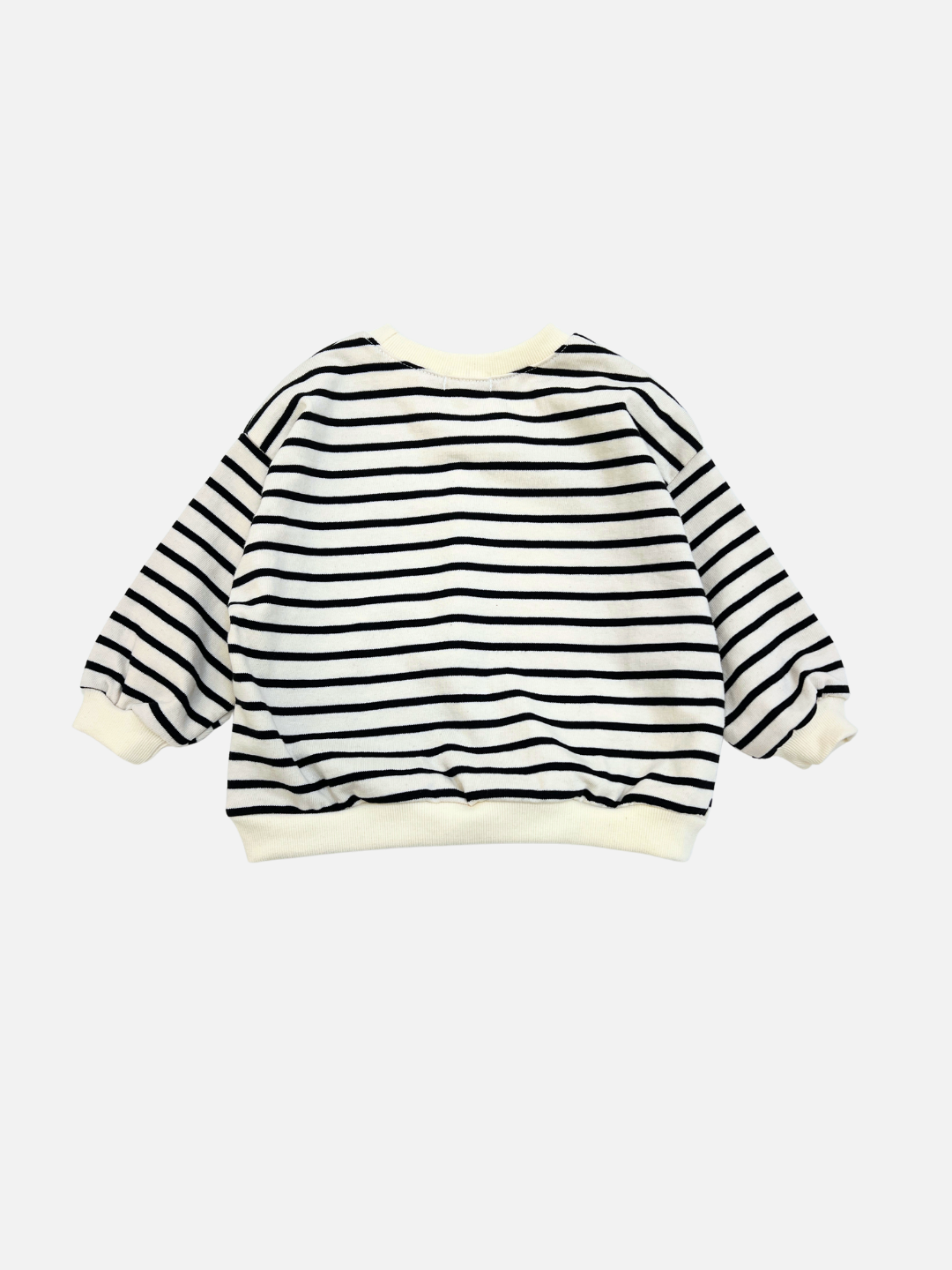 The BRETON BABY SWEATSHIRT is a long-sleeve shirt with black horizontal stripes on white, featuring ribbed cuffs and a waistband, shown against a plain background.