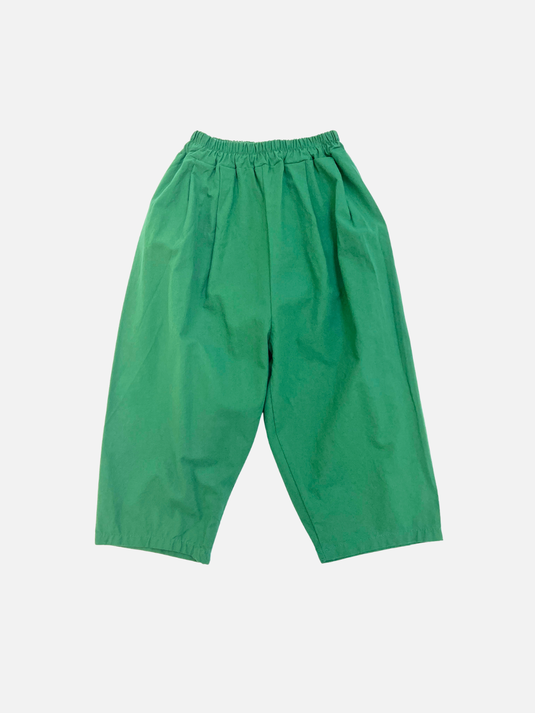 Green | The GARDEN COTTON PANT in green features a wide-leg silhouette and elastic waistband, made from soft cotton, and is shown flat on a plain white background.