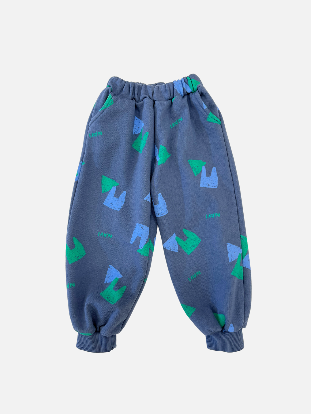 Front view of kids blue sweatpants with an all over pattern of green and blue shapes and the brand name Navi.
