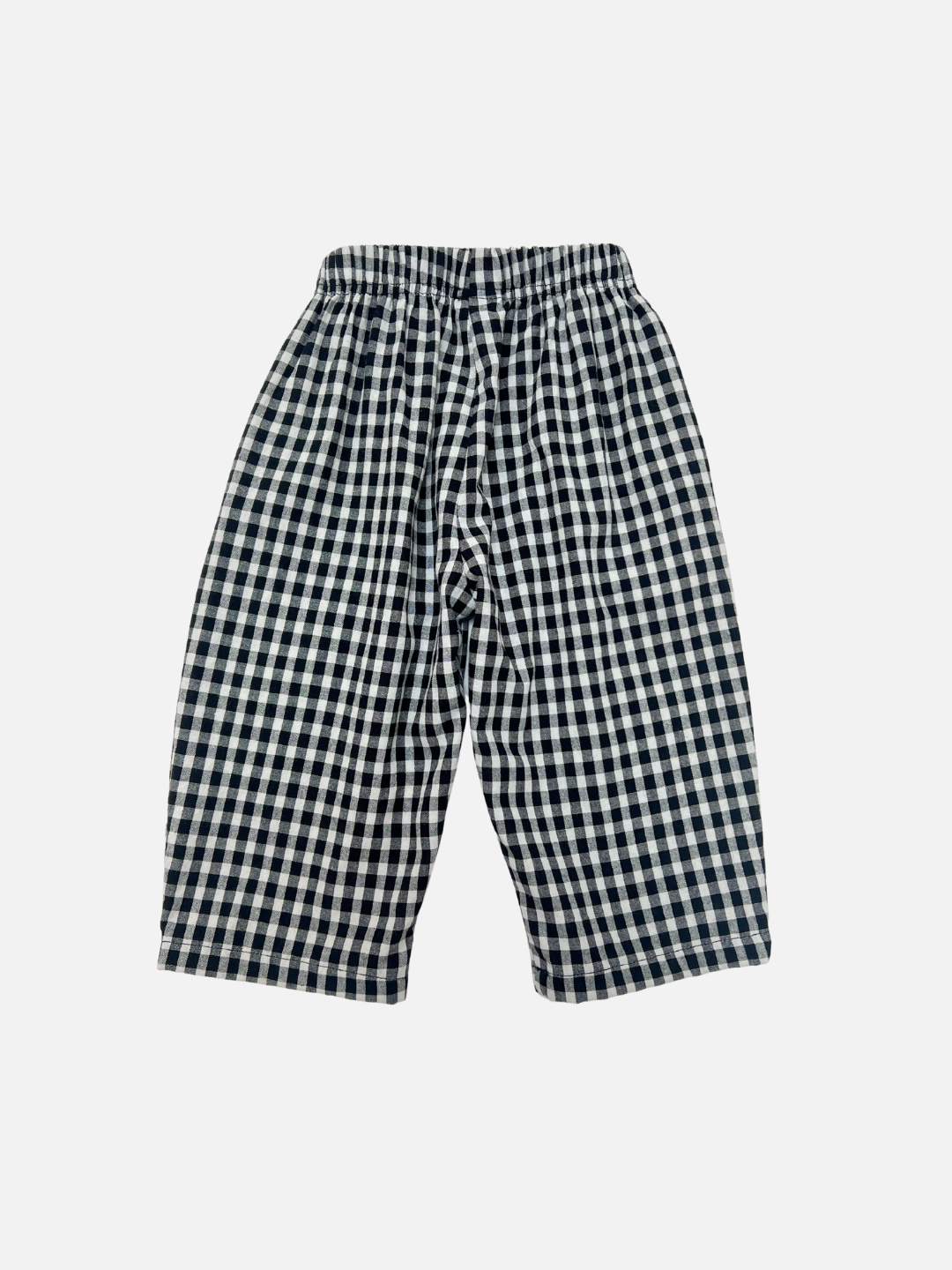 Back view of kids black and off-white gingham check pants.