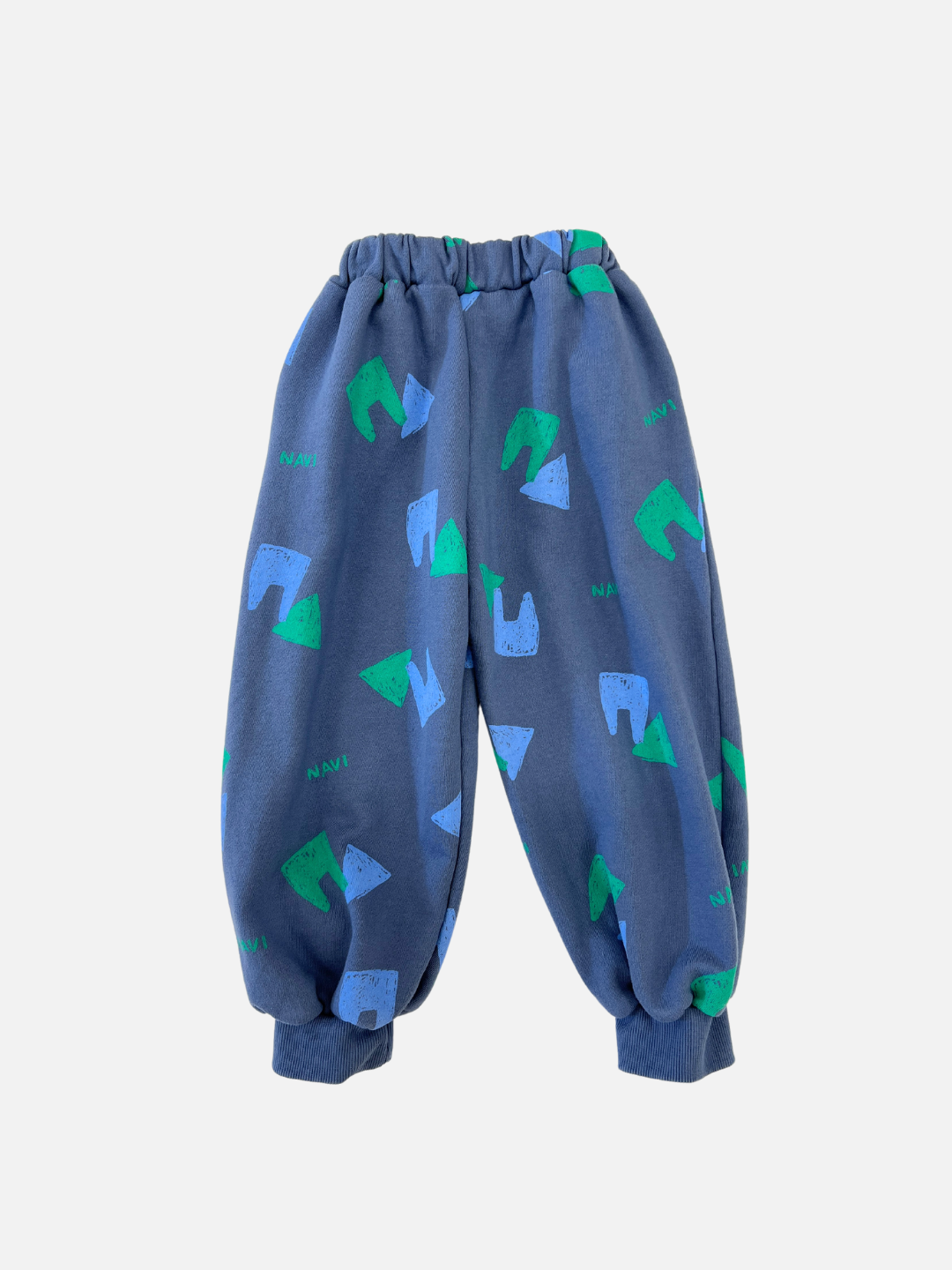 Vintage Blue | Back view of kids blue sweatpants with an all over pattern of green and blue shapes and the brand name Navi.